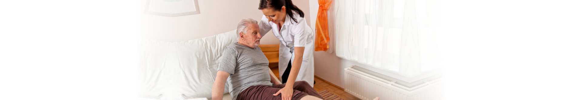 caregiver assisting her patient to bed